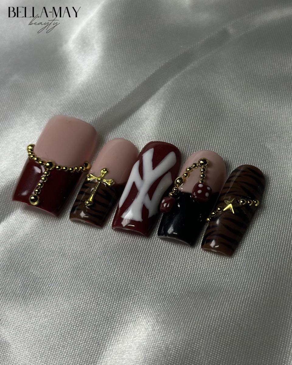 Burgundy and gold nail art set by Bella-May Beauty